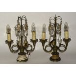 A pair of Edwardian metal table lamps, decorated with cut glass drops, converted to electricity,