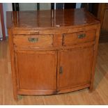 A hardwood bow-front cupboard chest, with two small drawers above two panelled doors,