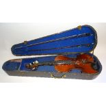 A Stradavarius style violin, with two bows, in fitted case,