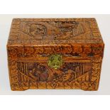 A Chinese camphorwood casket in the form of a blanket chest, with hinged top,