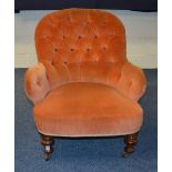 A Victorian buttonback armchair, upholstered in later pink velour,