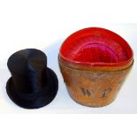 A vintage black silk top hat by Lincoln Bennett & Co London, in cushioned fitted leather hat box,