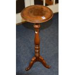 A 19th century turned mahogany wine table, with circular top, raised on tripod base,
