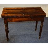 A 19th century rosewood fold over card table, the swivel top enclosing green baise lined interior,