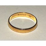 An 18ct gold wedding band, stamped 750 to underside, ring size J, 1.