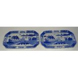 A pair of Chinese export blue and white dishes, depicting figures in Oriental landscape,