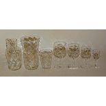 A suite of dimple impressed glassware circa early 20th century, to include tumblers, jug, wine,