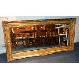 A reproduction Victorian style gilded overmantle mirror,