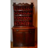 A Victorian mahogany open bookcase on cupboard base,