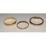 Two 18ct gold wedding bands, ring sizes L and R, 18 stamped to underside, 4.