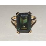 A 9ct gold dark green tourmaline ring, with large emerald cut tourmaline to centre measuring 1.