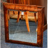 A Victorian walnut framed wall mirror,