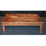 A hardwood rectangular coffee table, decorated with metal roundels and brackets,