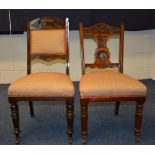A set of six oak dining chairs, four with carved splat back and cushioned seat,
