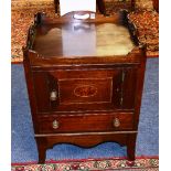 A 19th century mahogany commode cabinet, with tray gallery top above panelled door and drawer,