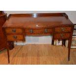 A vintage mahogany dressing table by Siesta, with central drawer flanked by two small drawers,