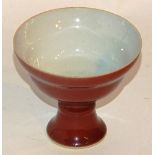 A Chinese Sang De Boef cup, the circular top raised on stem base, six character marks to underside,