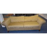 An upholstered two seater sofa by Ethan Allen, upholstered in gold coloured fabric,