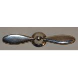 **A silver brooch modelled as a plane's propeller, stamped '925' verso,