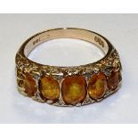 A gold five stone citrine and diamond ring,