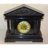 A Victorian black slate mantel clock, the white enamel chapter ring dial with Arabic numerals,