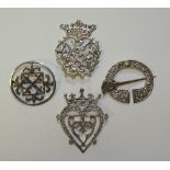 Four Scottish silver brooches, of varying design,