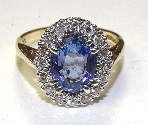 A 9ct gold tanzanite and diamond cluster ring,