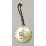 A George III gold coin, with coat of arms to obverse and kings head to reverse, dated 1790,