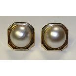 A pair of 14ct gold pearl earrings, the large central pearl mounted in octagonal gold mount,