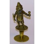 **A Victorian brass 'Mr Punch' bar lighter, with hole through cigar in Mr Punch's mouth,