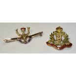 Two gold and enamel military badges,