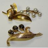 A 14ct gold pearl brooch, in the form of a plant, stamped 14k, 6cm long,