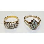 A 9ct gold opal ring, the diamond formation set with nine round cabochon opals,