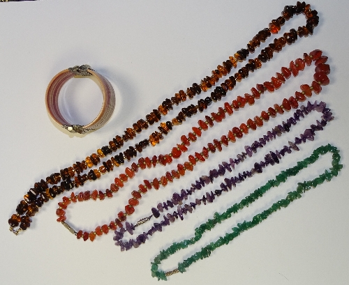 Four sets of beads, including amethyst, cornelian, green agate and amber style,