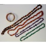 Four sets of beads, including amethyst, cornelian, green agate and amber style,