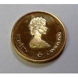 A 1976 Elizabeth II Canadian 100 dollar gold proof coin, to mark the Montreal Olympics,