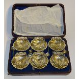 **A boxed set of six Victorian plated scallop shell salt dishes,