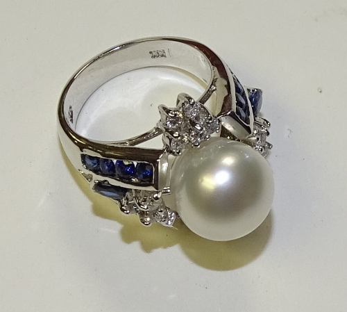 A 14ct white gold pearl, sapphire and diamond ring,