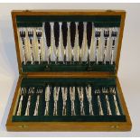 **An oak cased set of 12 plated Dubarry pattern fish knives and forks, by Charles James Allan,