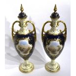 A pair of Coalport vases with lids,