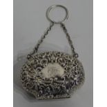 **An early George V silver ring purse, hallmarks for Birmingham 1909-10 Boots Pure Drug Company,