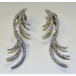 A pair of 14ct white gold and diamond spray earrings,