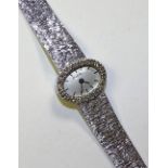 A 9ct white gold and diamond lady's Bueche Girod cocktail watch,