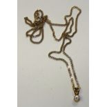 A 9ct gold chain with CZ pendant, stamped 375 to clasp, 61cm long unfastened, chain 7.