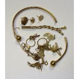 A small quantity of scrap gold, mostly 9ct, to include broken bangle, broken chain, earrings etc,