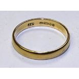 An 18ct gold wedding band, stamped 750 to underside, ring size K,