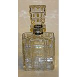 An oblong square crystal decanter with silver collar, hallmarks for London 1967 Mappin & Webb,