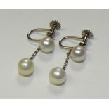 A pair of 9ct white gold freshwater pearl drop earrings, with screw backs for non pierced ears,