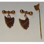 A 9ct gold Tazmania cufflink and tie pin set, stamped 9ct to reverse, 4.