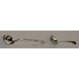 A silver ladle, hallmarks for London 1872 William Turner, with foliate decoration to stem,